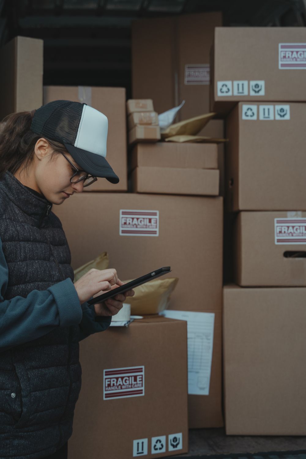 A Harbrook operative scanning cartons onto a delivery vehicle